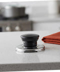 Upgrade Your Whistling Kettle With This Stainless Steel Knob Replacement Kit That Offers An Easy Install, Comfortable Grip, And Durable Build To Protect Your Lid Handle While Keeping Kitchen Swag Super Fresh. black stainless steel kettle lid knob replacement kit on countertop