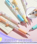 DIY Gel Pens With Cute Stickers Six Pack 0.7mm Black Ink Smooth Writing Quick Dry Journaling Pens on notebook with colorful shells.