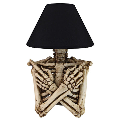 Rest In Pieces Gothic Skeleton Table Lamp With Black Shade 14 Inch Tall Spooky Skeletal Torso Accent For Living Room Or Bedroom Decor Halloween Lighting Dark Vintage Vibe, showing a skeleton torso with crossed arms and black lampshade.