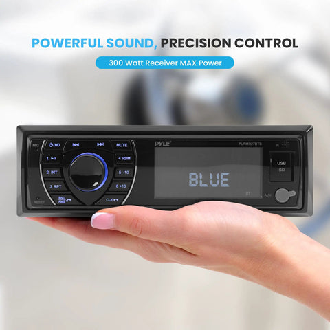 Hand holding 12V Marine Bluetooth Receiver Stereo for Boats Single DIN In Dash Radio, digital LCD display showing 'BLUE'.