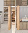 Rustic Wood Barn Door Pull Handle Set With Heavy Duty Sliding Hardware Kit on glass doors in a modern interior