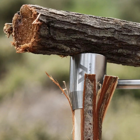 Close-up of Rugged Bushcraft Settlers Hand Auger with Scotch Eye drilling wood for camp structures like tripod cooking stands.