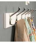 Wall Mount Wooden Coat Hooks And Rails With Zinc Alloy Entryway Organizer with coats and bags hanging on sturdy hooks.