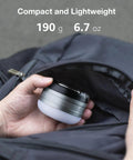Compact Rechargeable LED Camping Lantern With 410LM Five Light Modes fits in backpack, showing portable design.