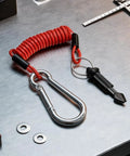 Stainless Steel RV Breakaway Cable With Transparent Jacket High Strength Lanyard For Trailers with carabiner on metal surface