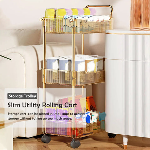 Sleek Clear Acrylic 2 Tier Rolling Utility Cart With Sturdy Handle And Smooth Lockable Wheels Compact Storage Trolley For Kitchen Bathroom Tight Spaces Easy Clutter Control Game Changer beside a couch with colorful items.