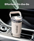 Double Wall Portable Breastmilk Cooler With Thirty Oz Capacity in a car console, perfect for busy moms on the move.