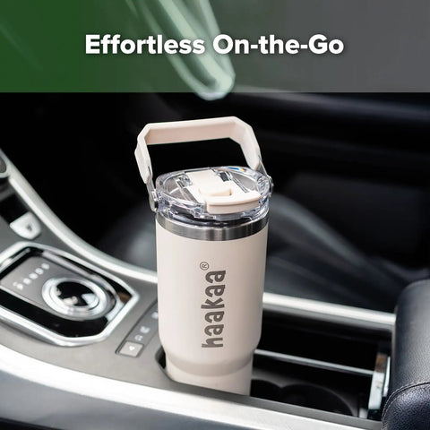 Double Wall Portable Breastmilk Cooler With Thirty Oz Capacity in a car console, perfect for busy moms on the move.