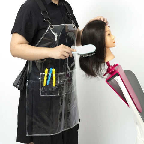 Transparent Waterproof Hair Stylist Apron With Adjustable Straps in use during hair styling on mannequin, 29.5 inch long