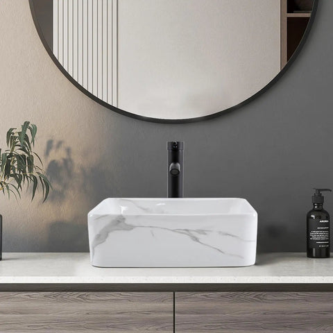 Rectangular Above Counter Vessel Sink 16 By 12 Inch Porcelain Ceramic Bathroom Sink With Faucet And Pop Up Drain Included White And Black Finish Stain Resistant Sleek Modern Vanity Upgrade For Your Bathroom displayed on a wooden vanity against a dark wall.