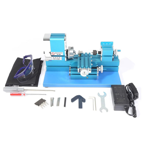 Top Shelf Compact Mini Metal Lathe Motorized Benchtop Milling System with tools, safety glasses, and accessories for hobbyist projects.