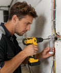 Slick Drill Dust Cover Attachment For Saws And Drill Bits With No Sweat Debris Capture System in use on drywall with a drill.