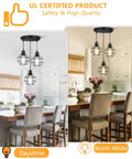 Farmhouse 3 Light Pendant Fixtures With Adjustable Cords For Kitchen Island And Dining Room Industrial Black Metal Cage Ceiling Lamp Vintage Style Hanging Pendant Lighting With Modern Rustic Boss Vibe above kitchen island showing daywhite and warm white lighting effect with chairs and decor.
