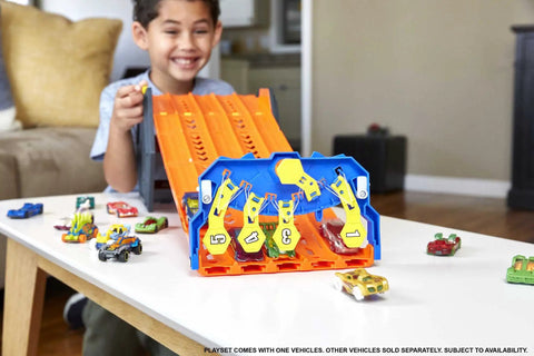 Child playing with Roll Out Raceway Track Set With Five Lane Racetrack And Storage Bucket Includes One Die Cast Car Collapsible Design.