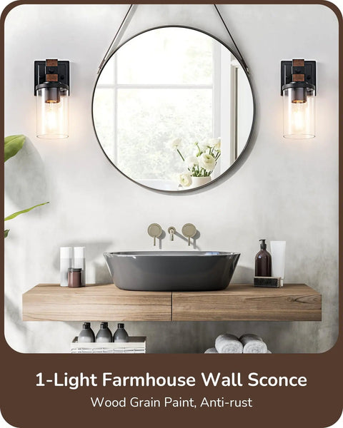 Top Tier Industrial Farmhouse Wall Sconces Set Of Two With Rustic Wood Grain Black Matte Finish And Clear Glass Shades in bathroom setting.