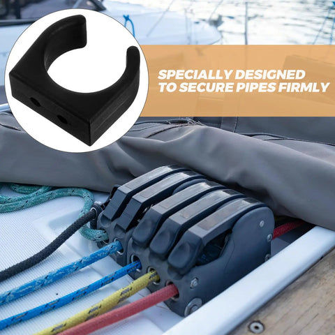 Close-up of black marine-grade Two Pack Nylon Water Pipe Clamps For Marine Use securing ropes on a boat deck.