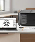 55W CO2 Laser Engraver And Cutter With 20x12 Inch Working Area Desktop Machine next to laptop displaying tiger design.