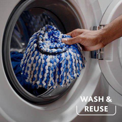 RinseClean Spin Mop And Bucket System For Clean Water Mopping Lets You Clean With Clean Water From Start To Finish Removes 99 Percent Of Bacteria With Just Water Built In Foot Pedal For Hands Free Wringer And Easy Rinse mop head being placed into washing machine for cleaning