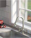 Hillwood Single Handle Two Hole Kitchen Faucet With Pull Down Sprayer Chrome Finish above sink and counter with pomegranates by window.