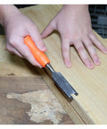 Economy 3 Piece Wood Chisel Set With One Half Inch Three Quarter Inch And One Inch Hardened Blades in use on wood surface