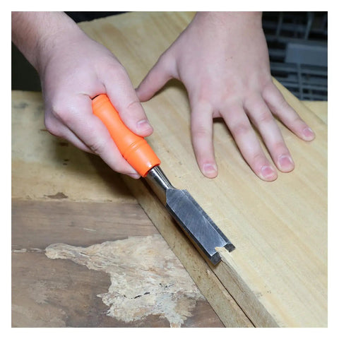 Economy 3 Piece Wood Chisel Set With One Half Inch Three Quarter Inch And One Inch Hardened Blades in use on wood surface