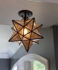 Star Shaped One Light Semi Flush Pendant With Antique Bronze Finish And Mercury Glass Shade in room setting