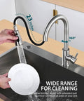 Pull Down Sprayer Kitchen Faucet In Brushed Nickel High Arc Design being used over a kitchen sink with a swivel sprayer