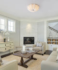 White Fabric Drum Shade Flush Mount Ceiling Light Fixture Three Light Modern Chandelier in living room setting