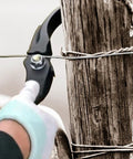 Heavy Duty Fence Wire Tightener Tool Barbed Wire Tensioner in use on wooden fence post for garden and farm fences