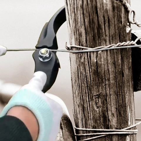 Heavy Duty Fence Wire Tightener Tool Barbed Wire Tensioner in use on wooden fence post for garden and farm fences