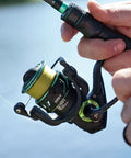 Viper X Spinning Reel Ultralight With Six Point Two To One Gear Ratio Ten Plus One Ball Bearings in use near water