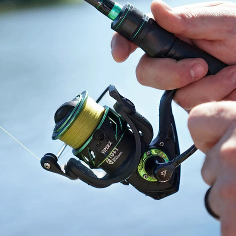 Viper X Spinning Reel Ultralight With Six Point Two To One Gear Ratio Ten Plus One Ball Bearings in use near water