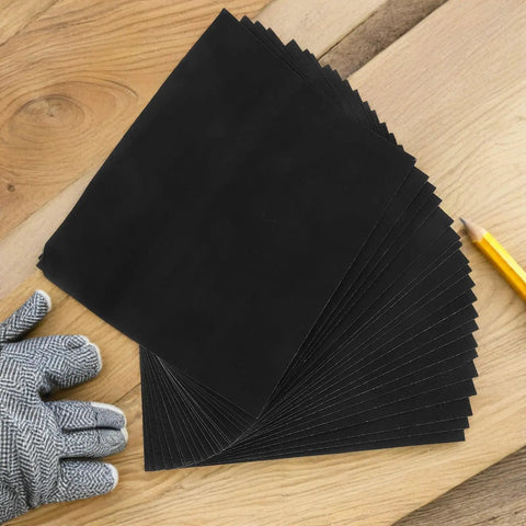 Get This Ultimate 20 Piece Wet Sanding Paper Assortment With Super Fine Grit Sheets For Smooth Results On Any DIY Or Pro Job Without Clogging. Black waterproof sandpaper pads displayed on wood surface.
