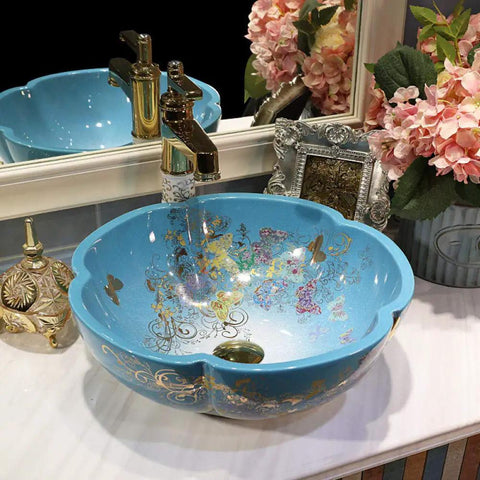 USZWBY Bathroom Vessel Sink in round blue ceramic with floral design, countertop basin sink, elegant bathroom fixture.