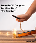 Hands using Fire Starter Rope 36 Inch Waterproof Wax Infused Hemp Tinder Wick Refill to ignite fire on wooden surface.