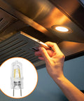 Installing Halogen Microwave Oven Light Bulb 120V 50W for GE over the range hood with G8 bi-pin base, replacing old bulb.