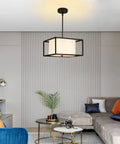 Dope Modern Semi Flush Mount Ceiling Light With Fabric Drum Shade And Black Metal Frame in a living room setting