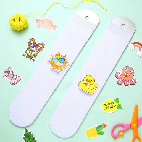DIY Sublimation Blank Socks Kit With 2 Metal Straight Sock Jigs And 2 Pairs Of Blank Socks For At Home Heat Press Dye Sublimation Printing And Creative Pattern Designs on light background with colorful stickers