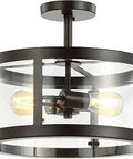 Oil-Rubbed Bronze Modern Drum LED Semi-Flush Mount Light Fixture With Clear Glass Shade lit with two visible bulbs