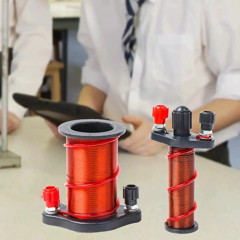 Physics Experiment Electromagnetic Induction Coil Kit for Students showing copper coils on classroom desk