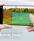 Person selecting activity zones on smartphone for Outdoor 2K Security Camera With Auto Spotlight, Person Tracking, Color Night Vision.