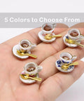 Hand holding miniature Whimsical Cherries Floral Tea Cup And Coffee Set With Magnetic Hinge Topper For Doors, Cat Lover Gift.