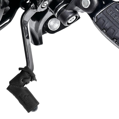Close-up of a charcoal black full grain leather shifter pad on a motorcycle gear lever, part of a set of 2 shoe protectors.