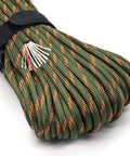 Close-up of Rugged Paracord Kit 100 Feet Of 7 Strand Nylon Fire Starter Rope With Red Tinder Cord And Fishing Line in Army Green Camouflage