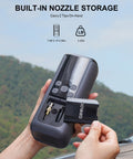 Person holding Dual Cylinder Tire Inflator with Auto Shut Off, showing built-in nozzle storage with tips visible.