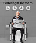 Elderly man sitting on a toilet safety rail, reading a newspaper, featuring Rock Solid Toilet Safety Rails For Seniors With Dang Good Grip Handles And No Sweat Setup Bathroom Assist Frame Giving Folks Peace Of Mind And Steady Support For Safe Independent Living At Home With Premium 300 Pound Weight Capacity For Rising Easy.