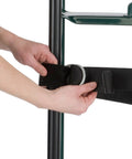 Harper Trucks 6781 appliance hand truck, dark green; close-up of hands tightening a black strap around the frame.