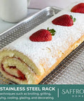 Heavy Duty Aluminum Half Sheet Pan With Stainless Steel Cooling Rack Set, 13x18 Inches, displayed with a swiss roll topped with strawberries.