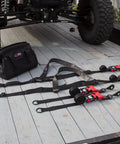 Ultimate UTV Tie Down Kit For Trailer Transport With Tire Bonnets, Wheel Lasso Straps, Speedwraps, and Storage Bag on Trailer