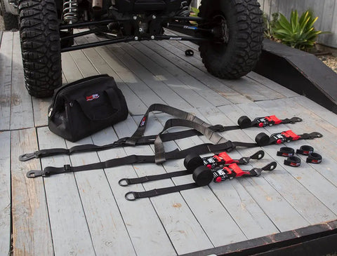 Ultimate UTV Tie Down Kit For Trailer Transport With Tire Bonnets, Wheel Lasso Straps, Speedwraps, and Storage Bag on Trailer